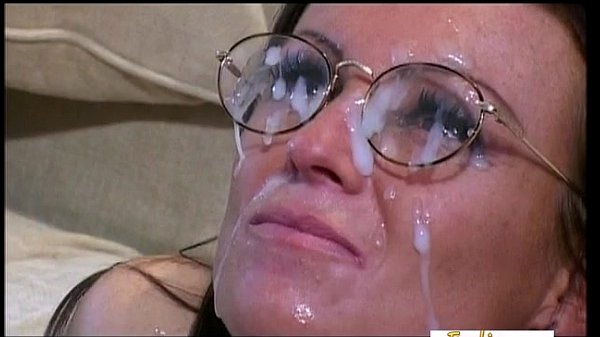Brunette receives a ton of jizz on her nerdy glasses